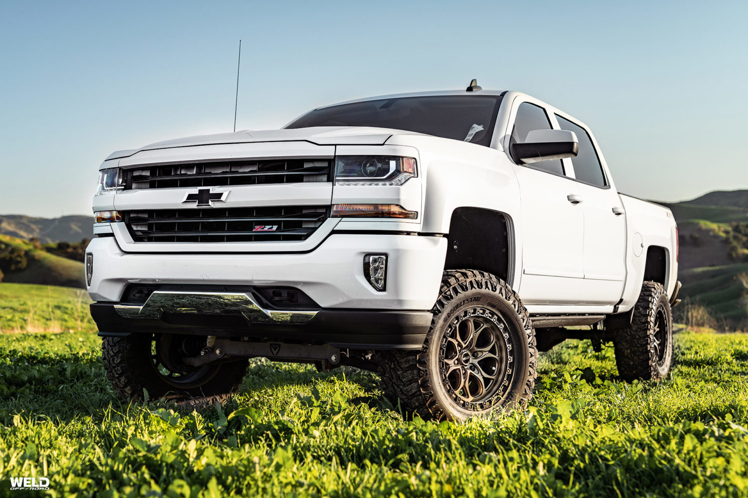 Bronze Ledge Silverado Z71 Chevrolet White Truck | Weld Wheels